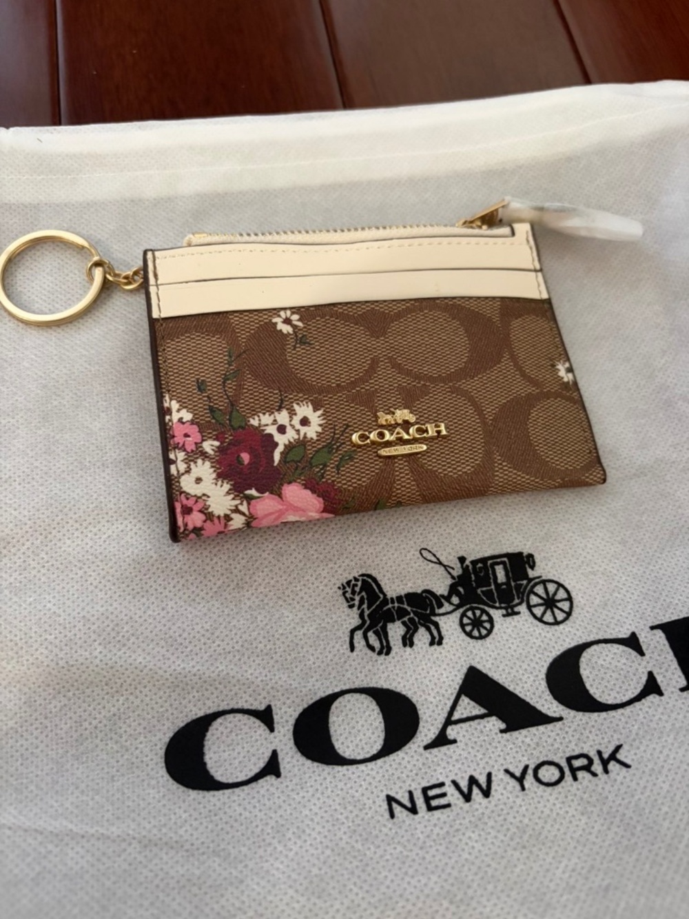 Coach Mini Skinny ID Case in sign brown canvas featuring a floral print